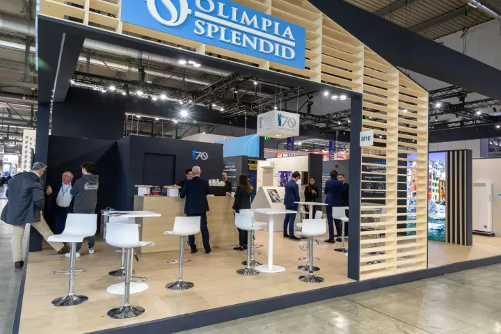 Olimpia Splendid stand with wooden house frame and 70th anniversary bar at MCE 2026
