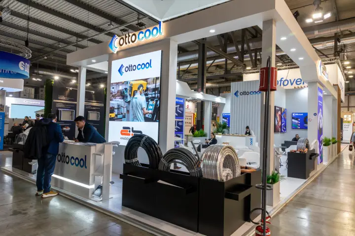 Ottocool stand with coils of insulated copper pipe and illuminated logo at MCE 2026