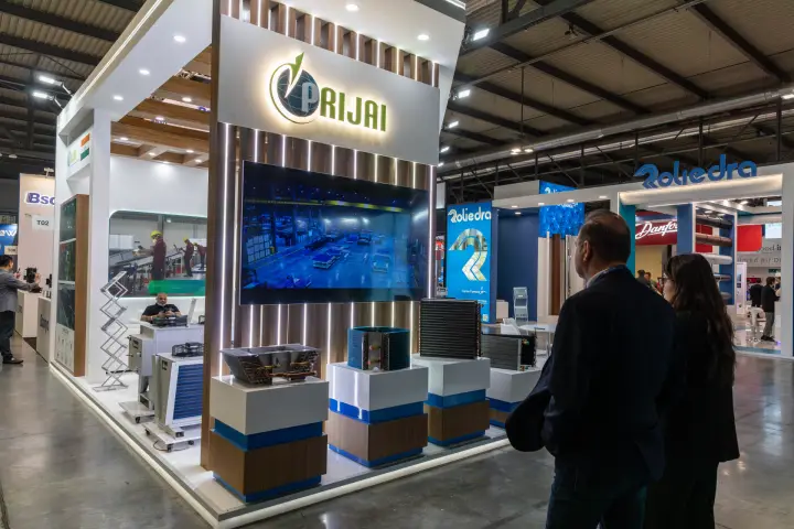 Prijai stand with heat exchanger coils on wood and blue plinths