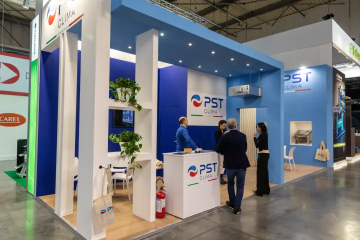 PST Clima stand in blue and white with a ceiling-mounted indoor unit at MCE 2026