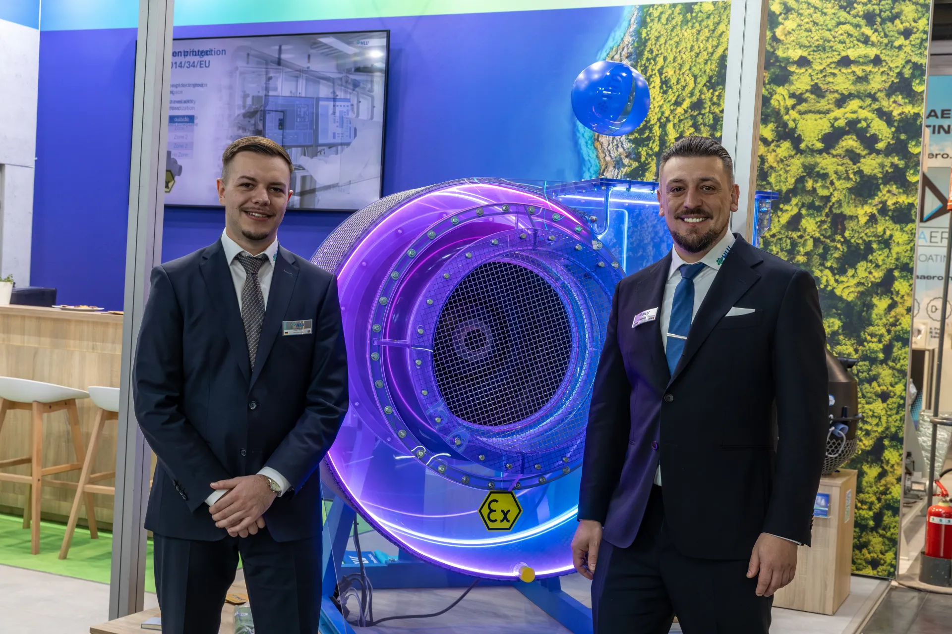 Purple-lit transparent ATEX fan housing on the HLU stand at MCE 2026