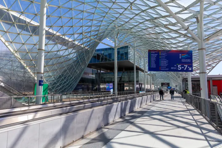 Reception Halls 5-7 sign near the East Gate beneath the glass roof at MCE 2026