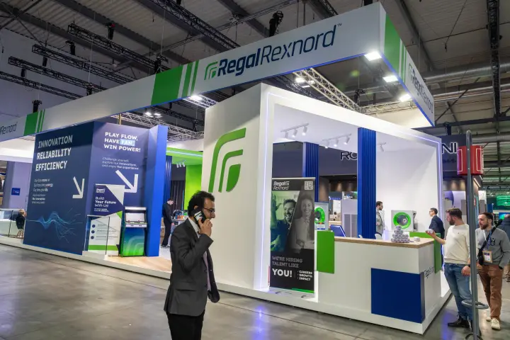 Regal Rexnord stand with 'Play Flow, Have Fan, Win Power!' game corner