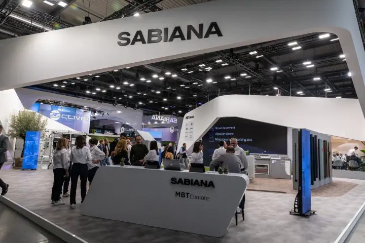 Sabiana and MBT Climate reception counter under a curved white canopy