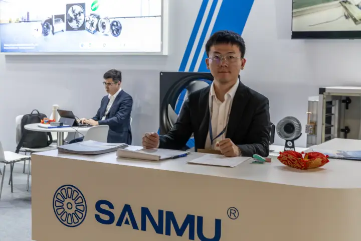 Sanmu reception counter with logo and a small centrifugal fan sample at MCE 2026