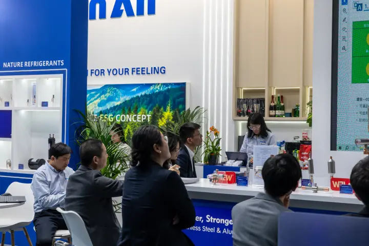 Seated visitors and coffee bar at the DunAn stand at MCE 2026