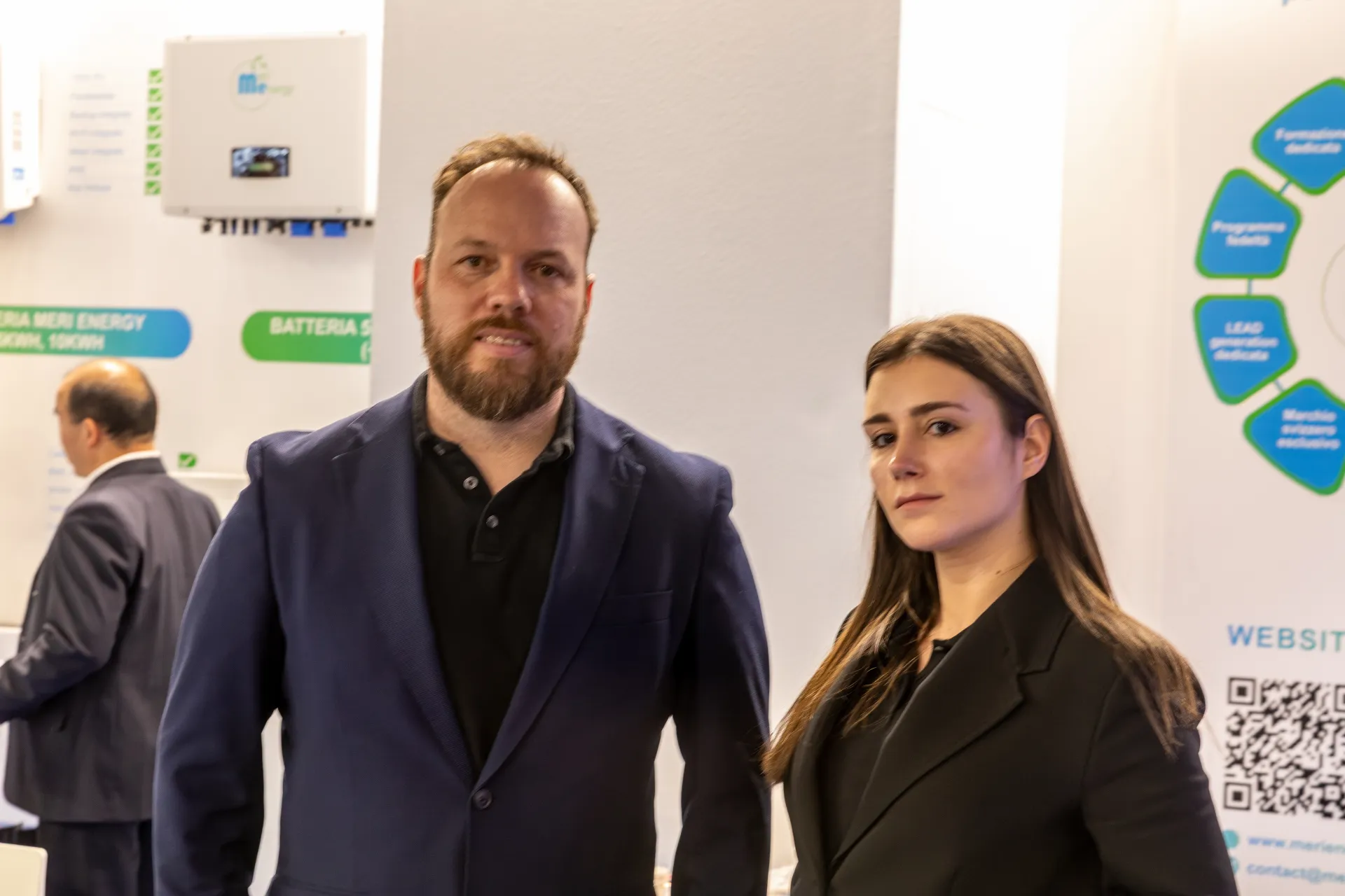 Second staff portrait at Meri Energy with battery signage behind at MCE 2026