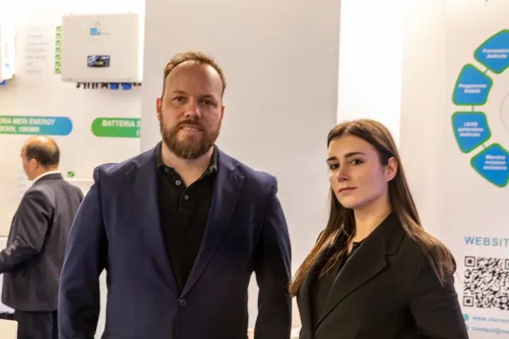 Second staff portrait at Meri Energy with battery signage behind