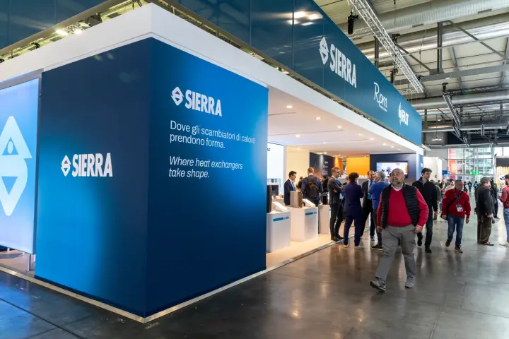 Sierra heat exchanger stand with visitors in the aisle at MCE 2026