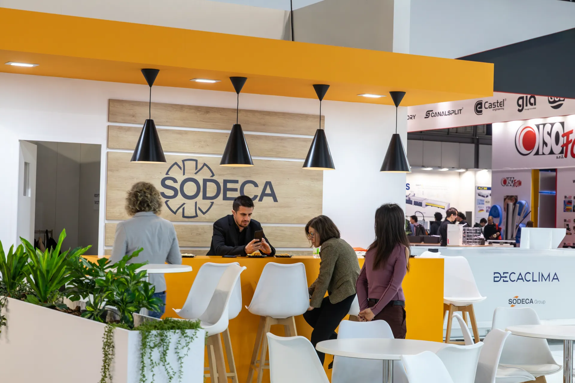 Sodeca hospitality bar with wood-panelled logo wall and Decaclima counter at MCE 2026