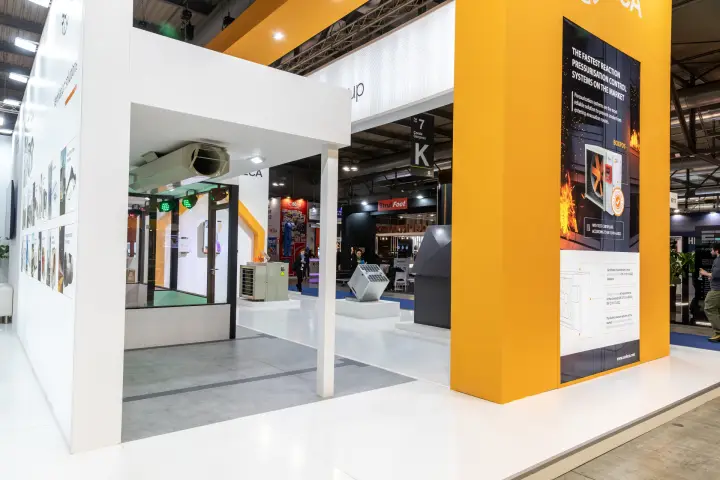 Sodeca stand corner with a poster on smoke-control pressurisation systems at MCE 2026
