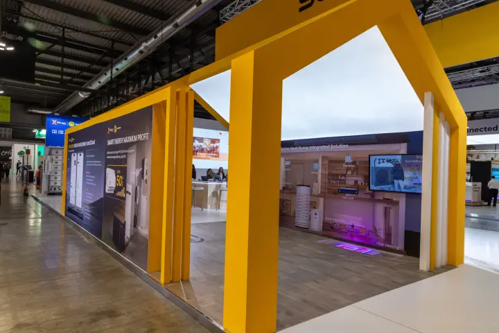 SolaX Power yellow house frame with heat pump room display at MCE 2026