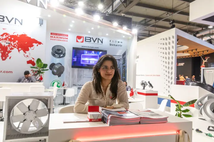 Staff member at the BVN reception counter with brochures at MCE 2026