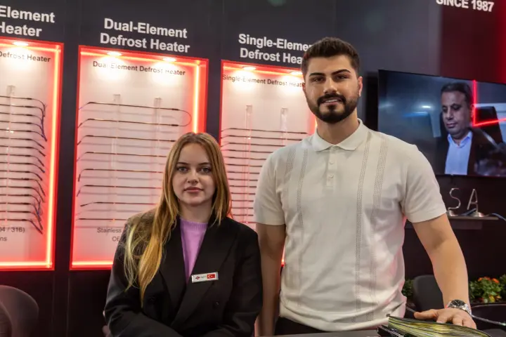 Staff portrait in front of defrost heater displays
