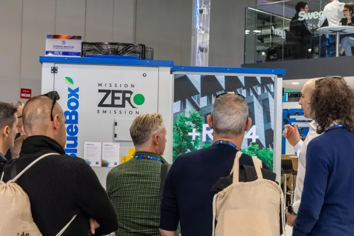 Swegon BlueBox LAMBDA Zero CO2 unit with 'Mission Zero Emission' graphics at MCE 2026