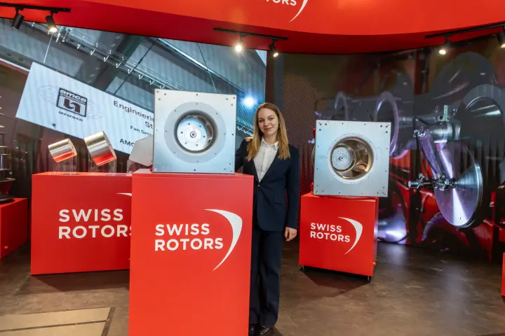 Swiss Rotors stand with AMCA member logo and plug fans on branded plinths