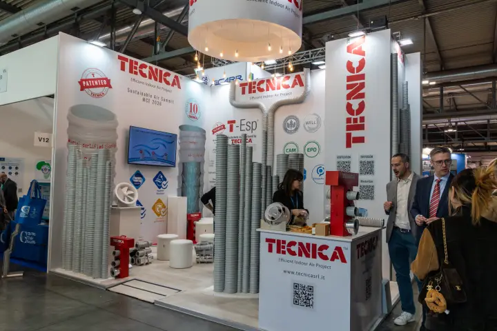 Tecnica stand built around towers of grey flexible ducts at MCE 2026