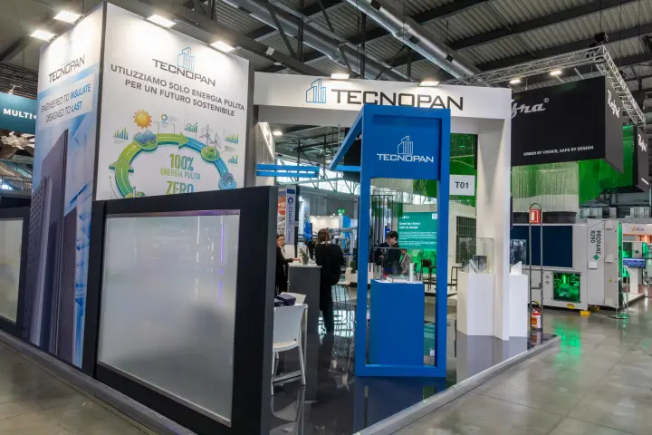 Tecnopan corner stand with clean-energy graphic and blue portal