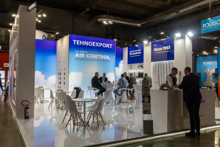 Tehnoexport stand with "It's about air control" wall and meeting tables at MCE 2026