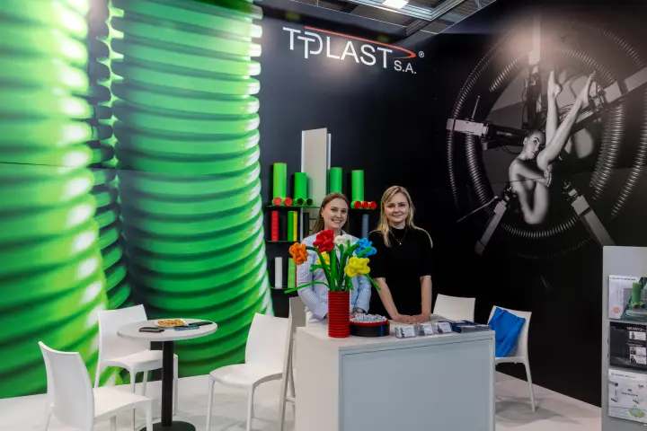 TT Plast stand with corrugated pipe graphics and duct samples
