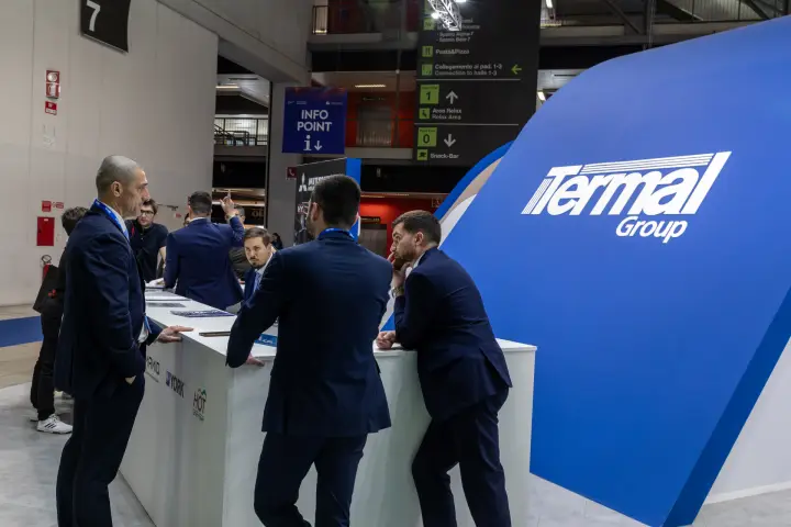 Visitors in conversation at the Termal Group reception counter at MCE 2026