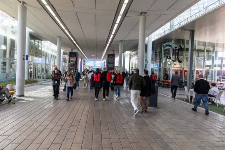 Visitors on the covered central walkway of Fiera Milano Rho