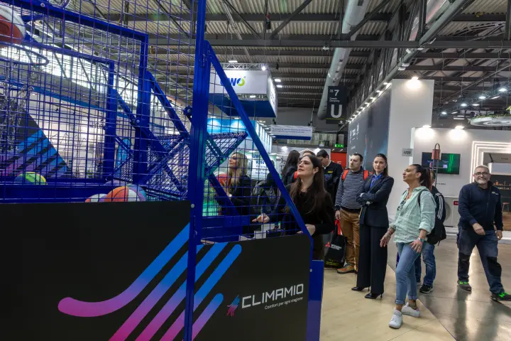 Visitors queue in the aisle to play the Climamio basketball game at MCE 2026
