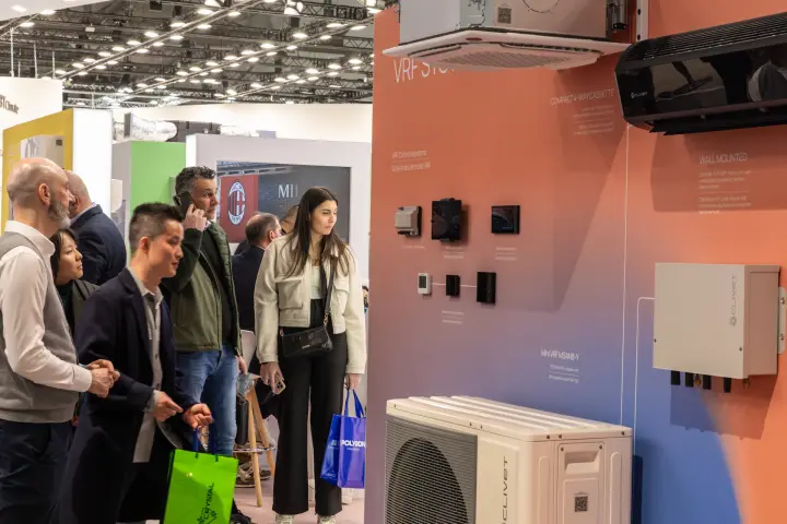 Visitors studying Clivet VRF control panels and indoor units at MCE 2026
