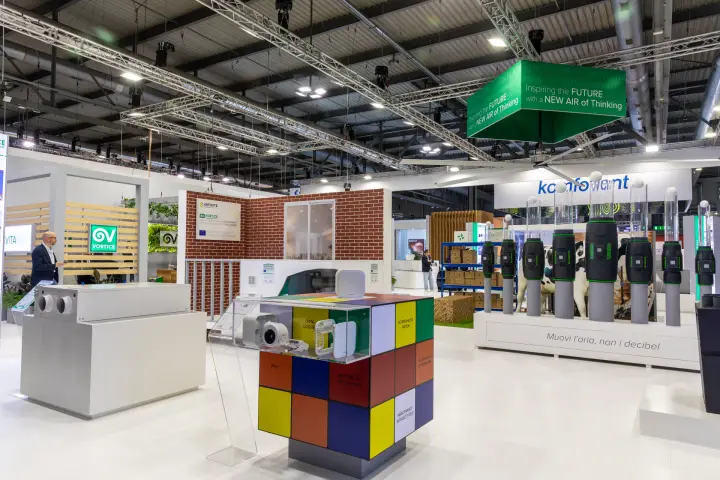 Vortice Rubik's cube plinth with small extract fans under hanging green banner