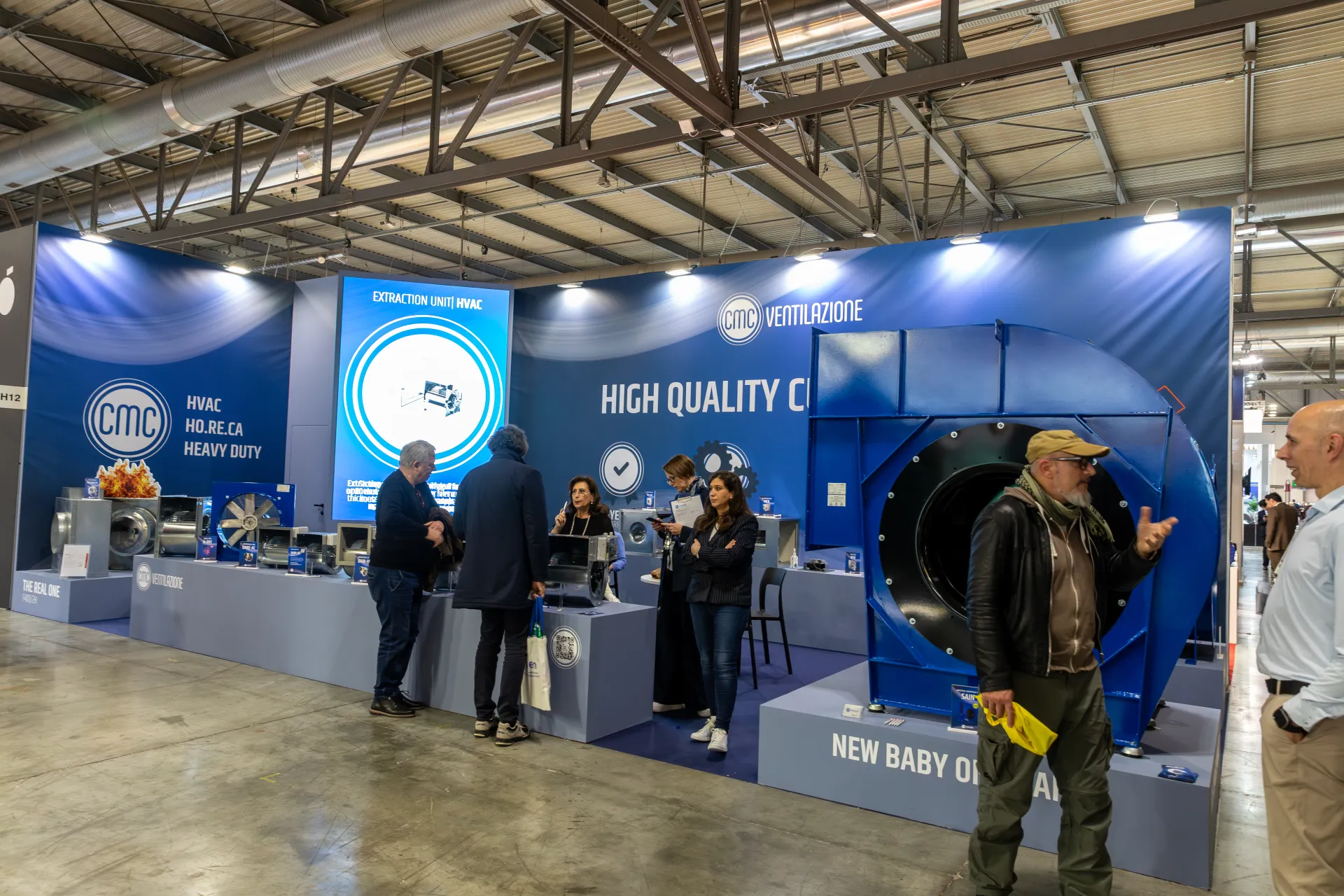 Wide view of CMC Ventilazione stand with large blue centrifugal fan at MCE 2026