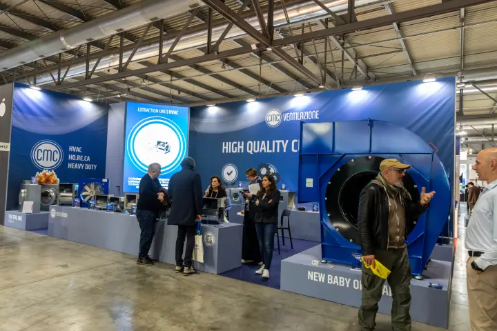 Wide view of CMC Ventilazione stand with large blue centrifugal fan