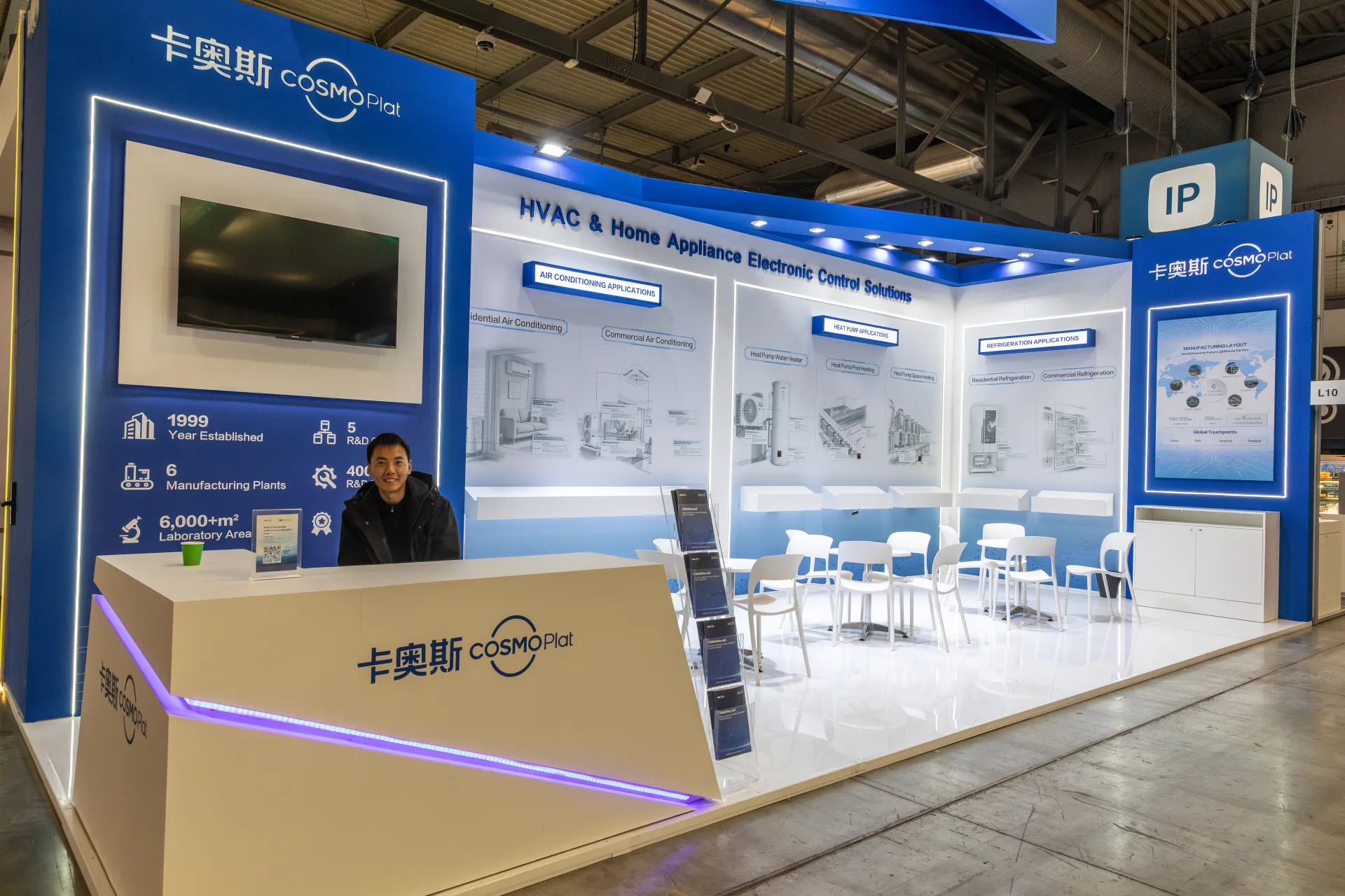 Wide view of the COSMOPlat booth with manufacturing layout panel at MCE 2026