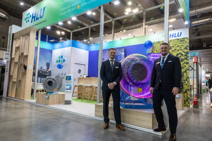 Wide view of the HLU stand with centrifugal fans and bar counter at MCE 2026