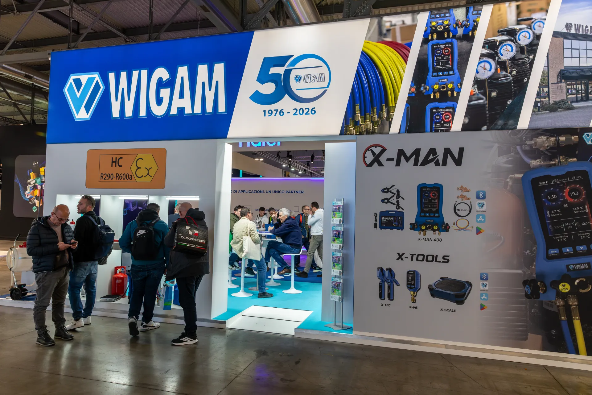 Wigam 50th anniversary stand with X-Man digital manifold and X-Tools graphics at MCE 2026