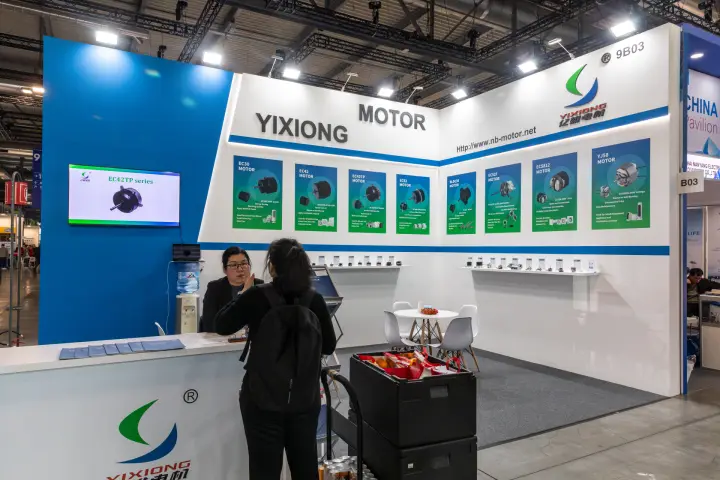 Yixiong Motor stand with EC and BLDC fan motor posters at MCE 2026