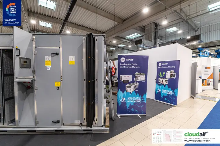 Air handling unit next to Trane roll-up banners on chillers and heating at Warsaw HVAC Expo 2024
