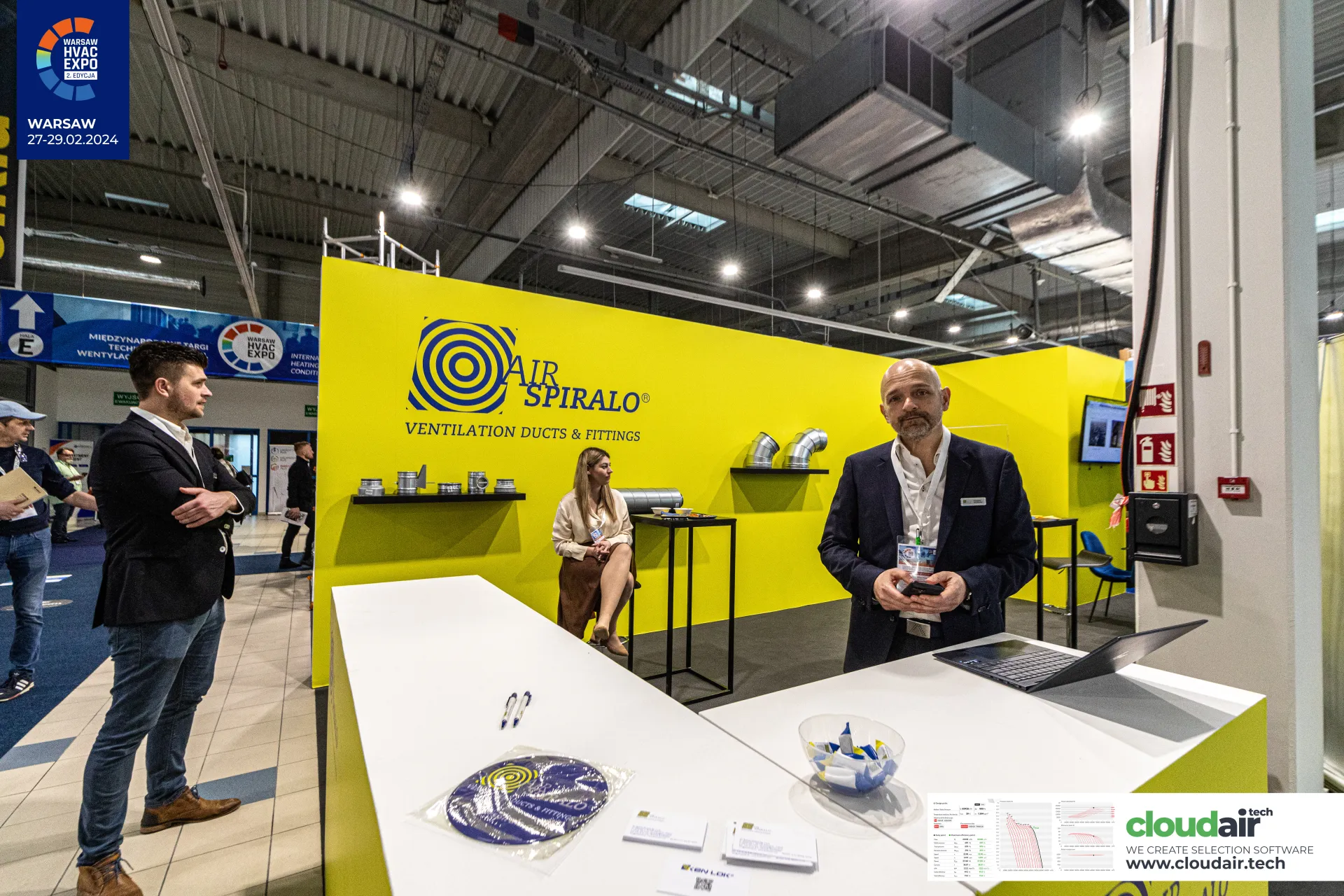 Air Spiralo yellow stand with the counter and duct fittings on shelves at Warsaw HVAC Expo 2024