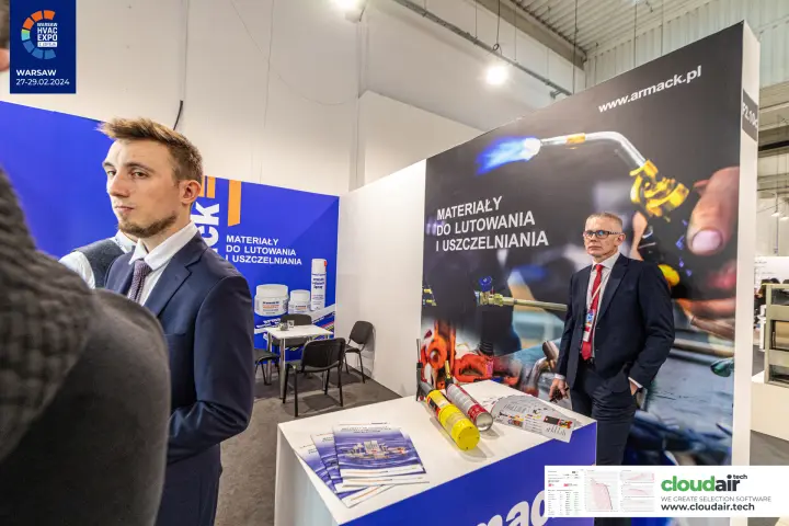 Armack brazing torch graphic with gas cartridges and catalogues on the counter at Warsaw HVAC Expo 2024
