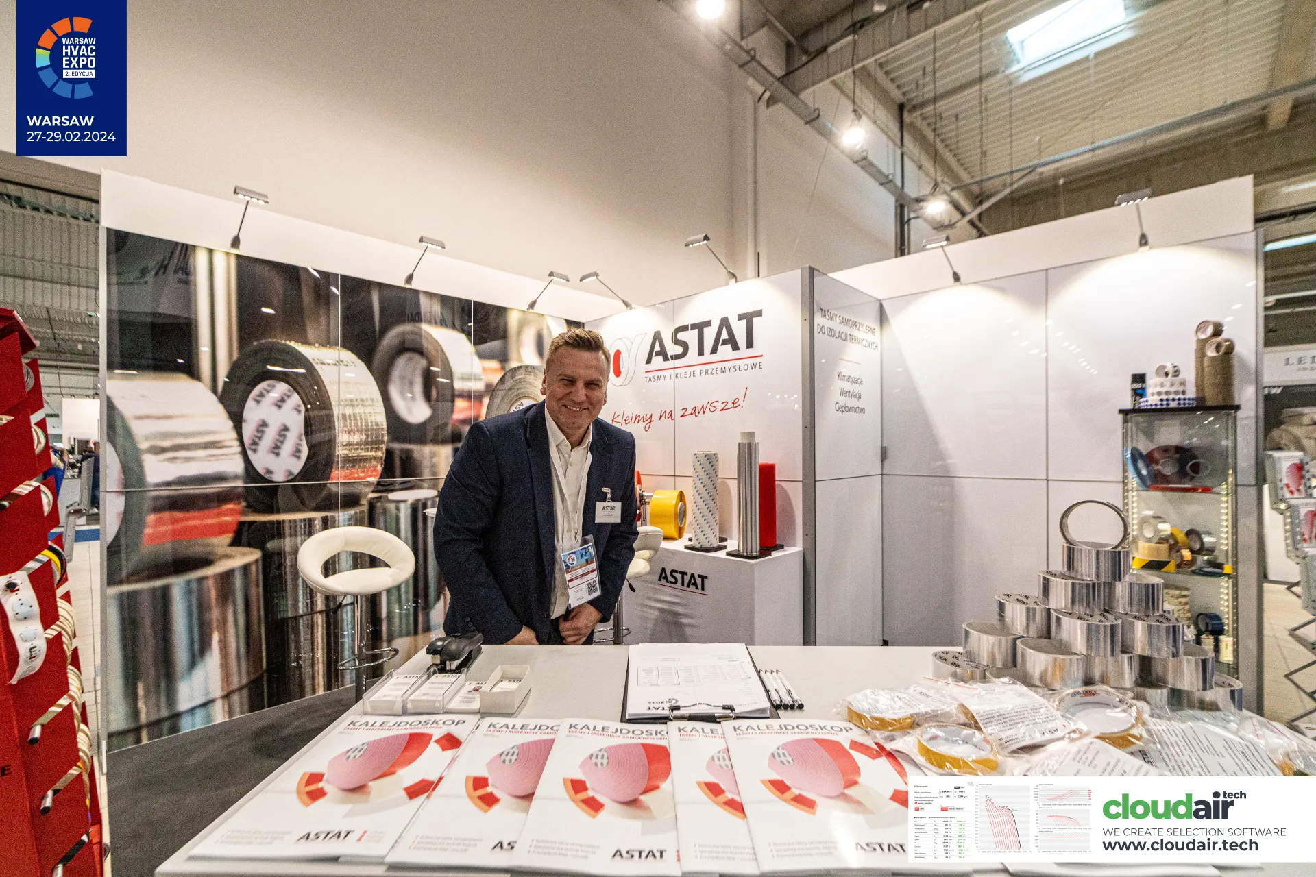 Astat front counter with a pyramid of aluminium tapes and catalogues at Warsaw HVAC Expo 2024