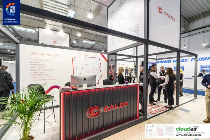 Caldo reception counter with red-lit logo and map of Poland at Warsaw HVAC Expo 2024