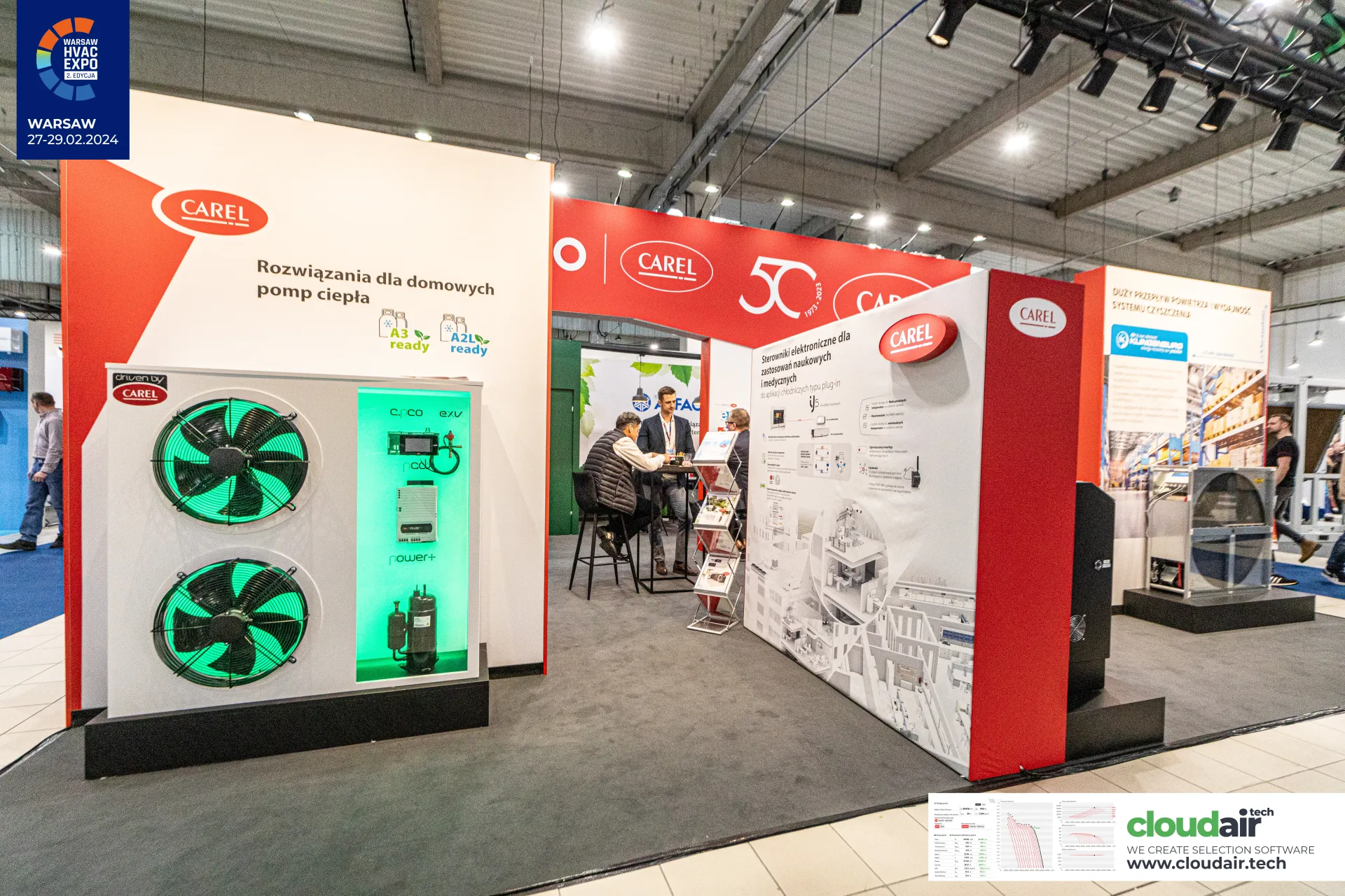 Carel stand with a green-lit heat pump cutaway and controller wall at Warsaw HVAC Expo 2024