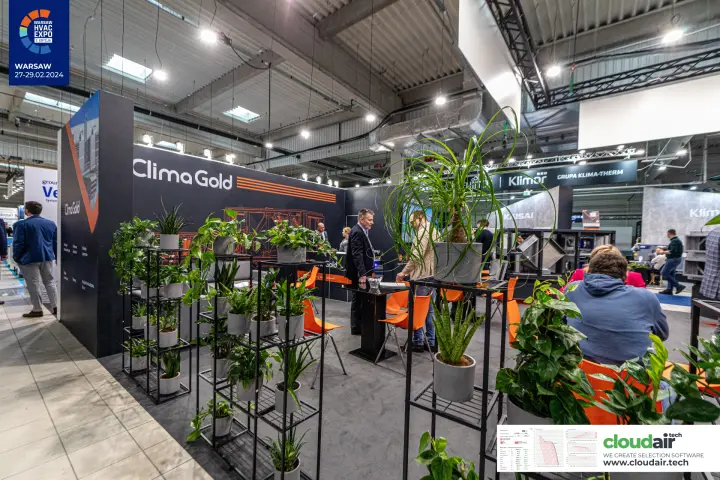 Clima Gold stand with black and orange graphics and shelves of potted plants at Warsaw HVAC Expo 2024