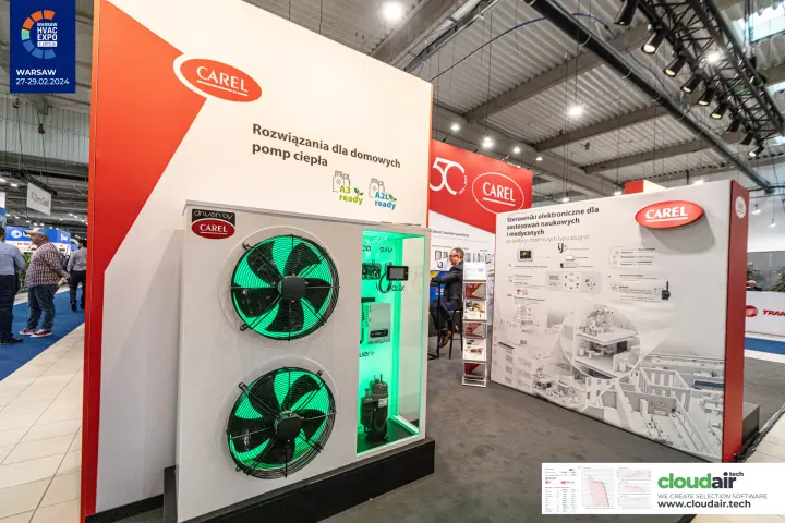 Close-up of Carel heat pump demonstrator with green-lit component window at Warsaw HVAC Expo 2024