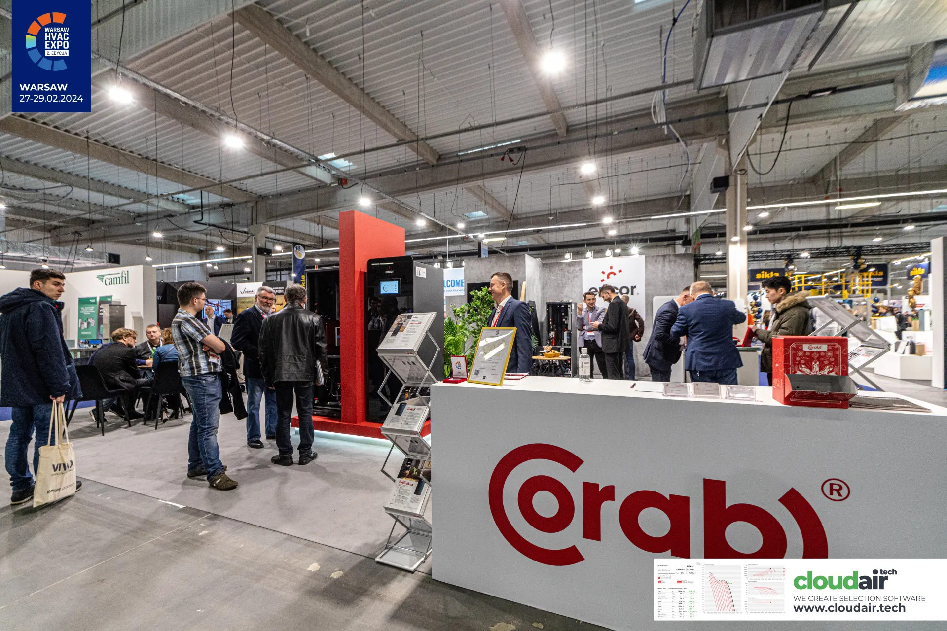 Corab counter with a red-framed Encor cabinet unit and award certificate at Warsaw HVAC Expo 2024