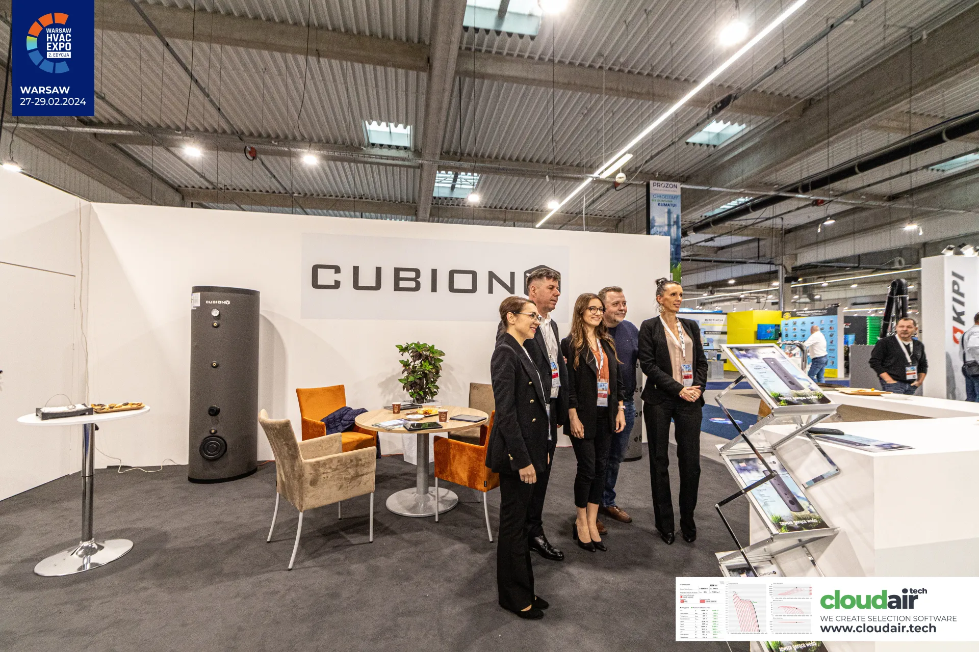 Cubion meeting corner with orange armchairs beside a tall hot water cylinder at Warsaw HVAC Expo 2024