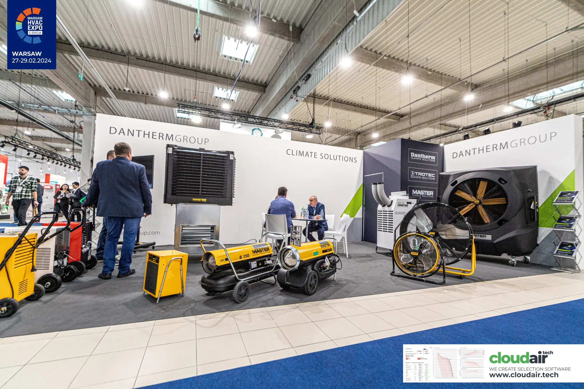 Dantherm Group stand with yellow Master heaters and drum fans at Warsaw HVAC Expo 2024