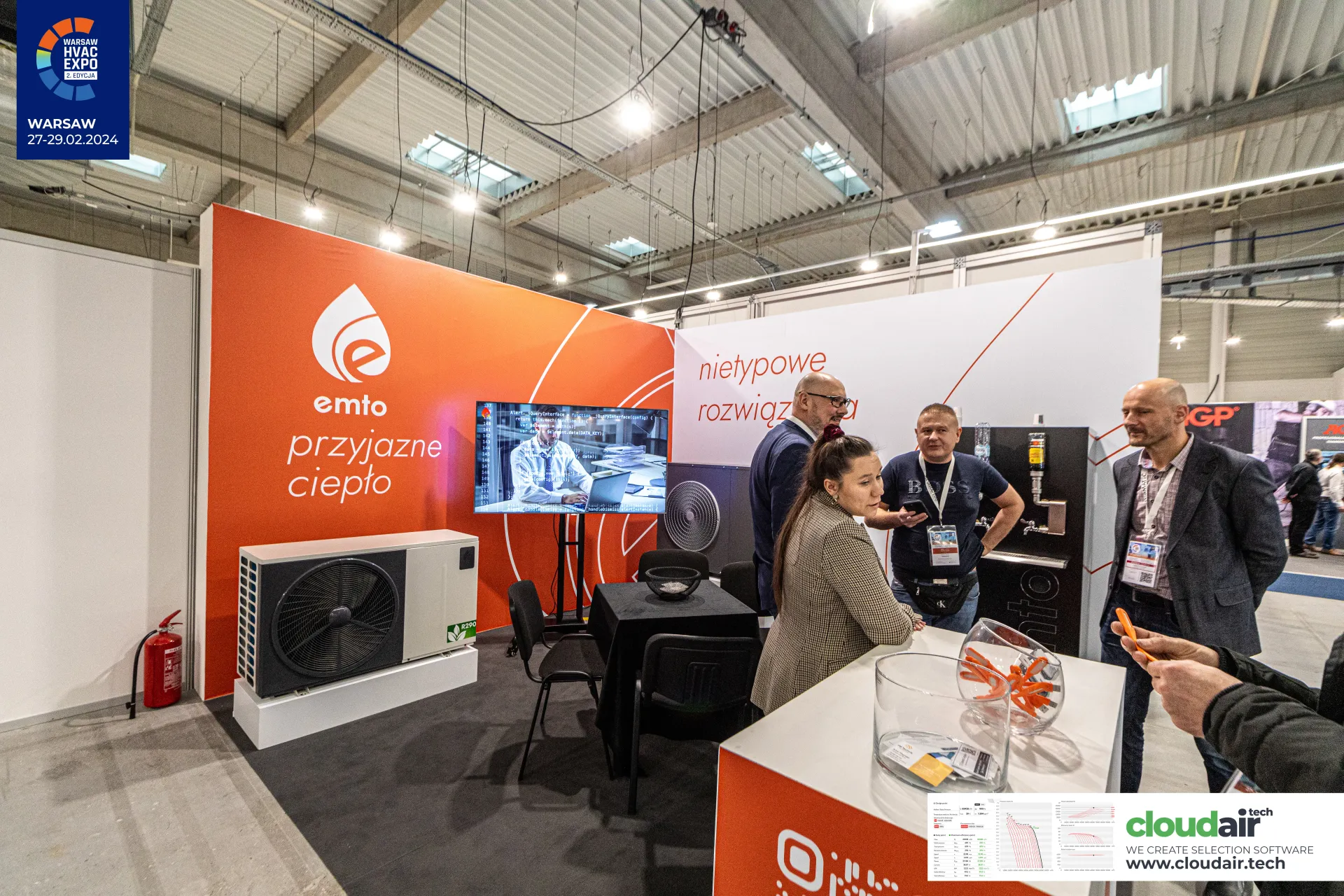 Emto stand with R290 outdoor heat pump and orange brand wall at Warsaw HVAC Expo 2024