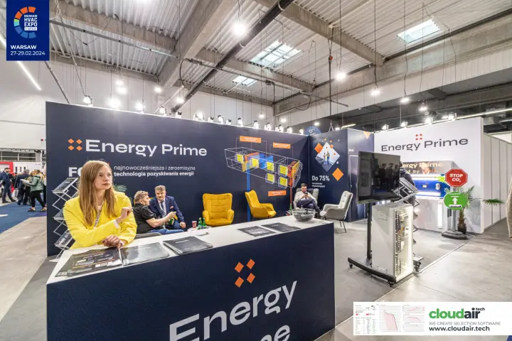 Energy Prime stand with navy walls and yellow lounge armchairs