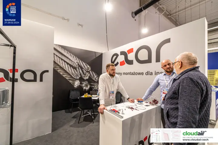 Exar stand with cable suspension hardware laid out on the counter