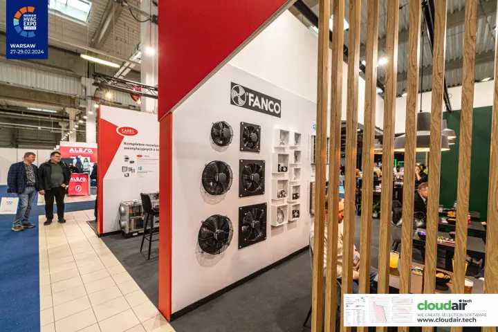 Fanco axial fans mounted on a white wall framed by red trim and wooden slats at Warsaw HVAC Expo 2024